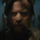 Ewan McGregor's Obi-Wan Kenobi, cloaked in shadow, as he looks at something concerned.